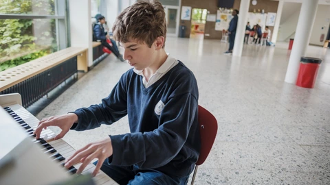 student playing the piano