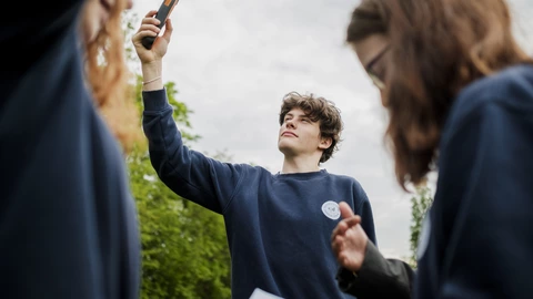Student is looking at a measuring device
