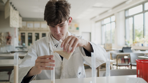 Student doing an experiment