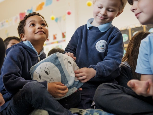 young students playing and smiling