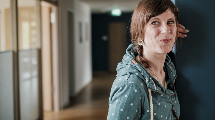 Employee stands at the door of a room