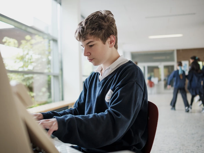 student playing the piano