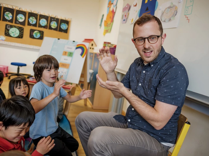 teacher singing with students